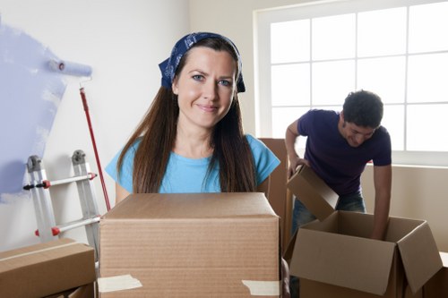 Professionals loading furniture into a truck for storage in Ealing
